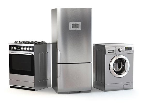 Et billede af en ovn, et køleskab i midten og en vaskemaskine til venstre